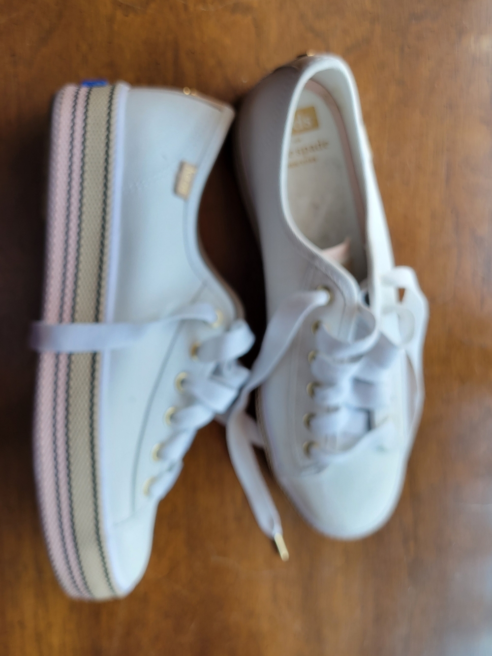 Keds White Sneakers with Pink Accents and Gold Eyelets